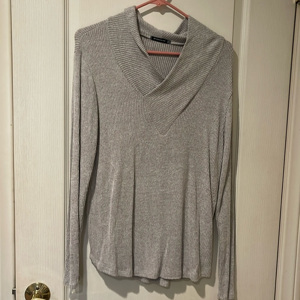 Tags cut out but fits like a medium.